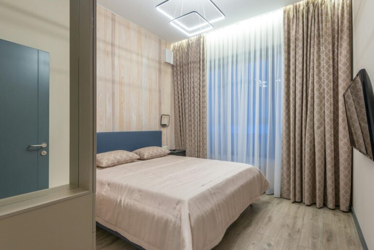 Contemporary bedroom featuring modern design with cozy decor and stylish lighting.